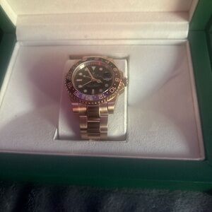 Rolex Gold and Black Watch with Multicolor Bezel